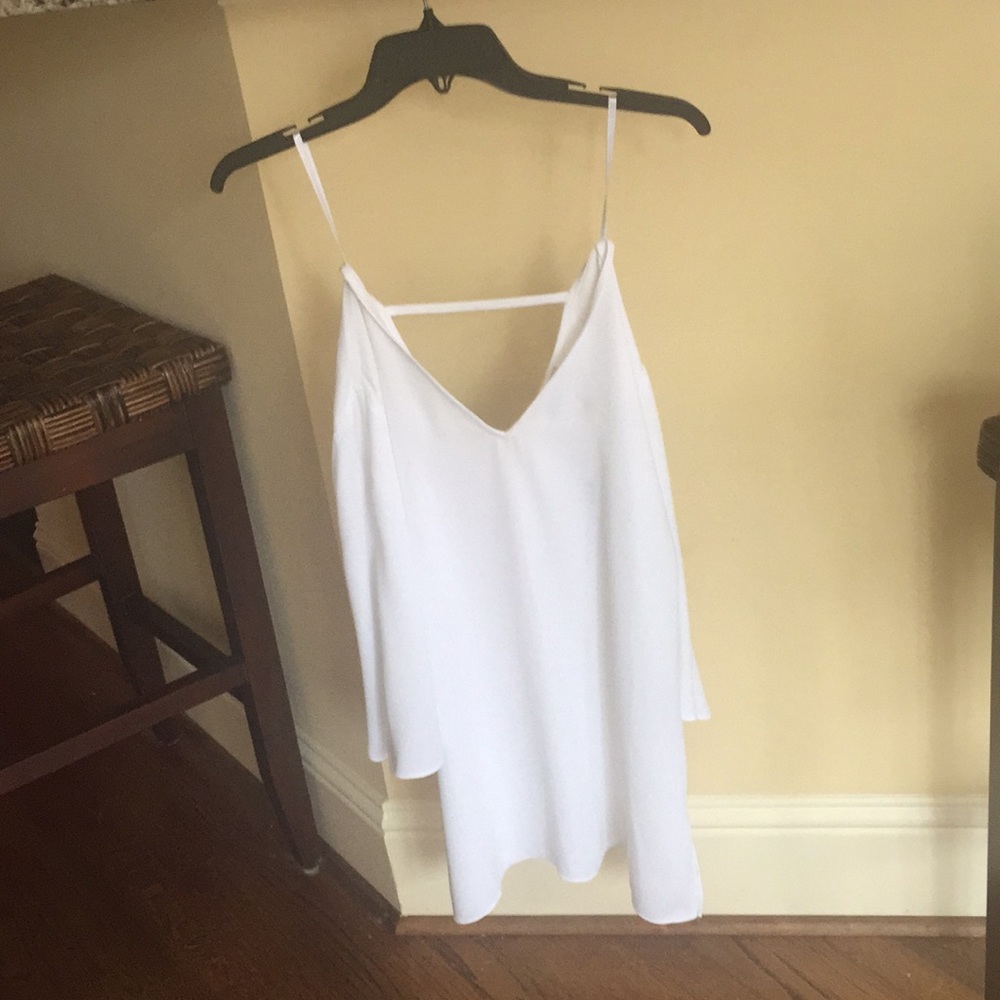 Chico’s top in Alabaster, size 0, new with tags.